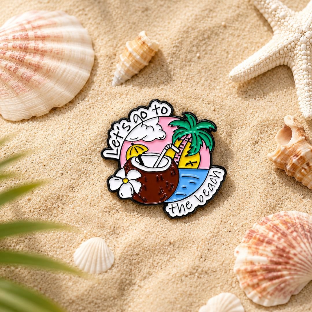 Tropical coconut drink enamel pin with palm tree, white flower and beach design.