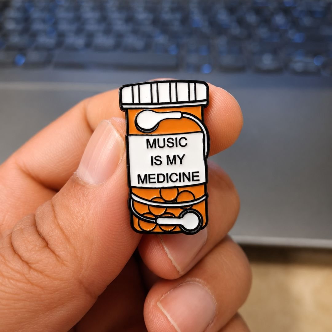 Music Is My Medicine medicine bottle design enamel pin with musical notes.