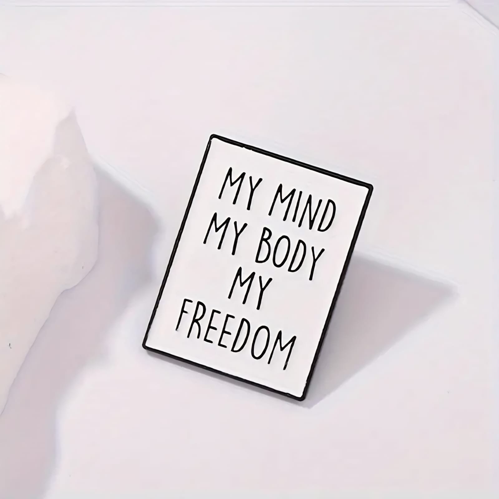 My Mind My Body My Freedom rectangular quote pin with black lettering on a light background.