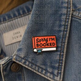 Sorry I’m Booked Enamel Pin – Orange Book Lover Quote Design